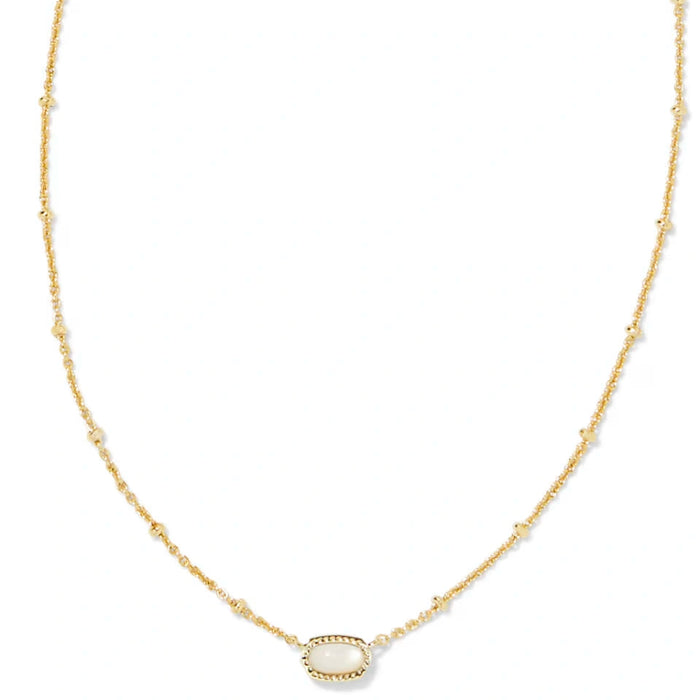 vibrant magnesite stone framed in polished gold-tone metal.