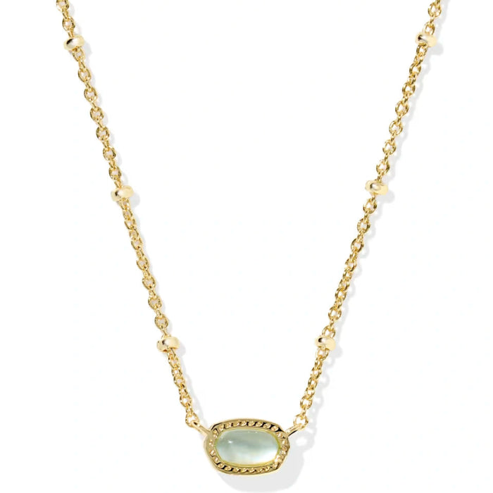 vibrant magnesite stone framed in polished gold-tone metal.