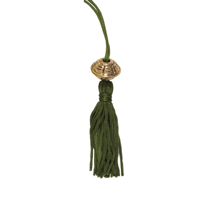 A whimsical dragon bookmark adorned with a tassel, ideal for book lovers and readers.