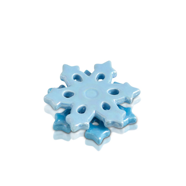 Blue snowflake-shaped object on a white background