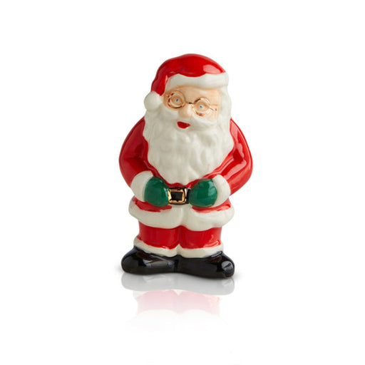 Small ceramic figure of Santa Claus on a white background