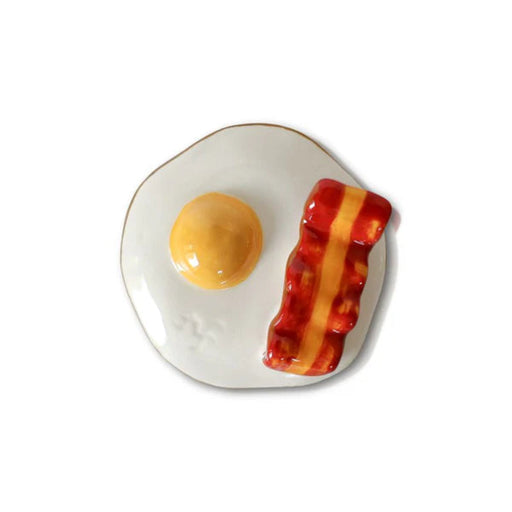 Nora Fleming Mini Decorative plate with a design of an egg and bacon on a white background