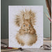 A decorative card displaying a playful squirrel, with a vibrant background of trees and foliage.