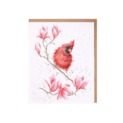 A greeting card featuring a red cardinal on a branch adorned with blooming magnolia flowers.
