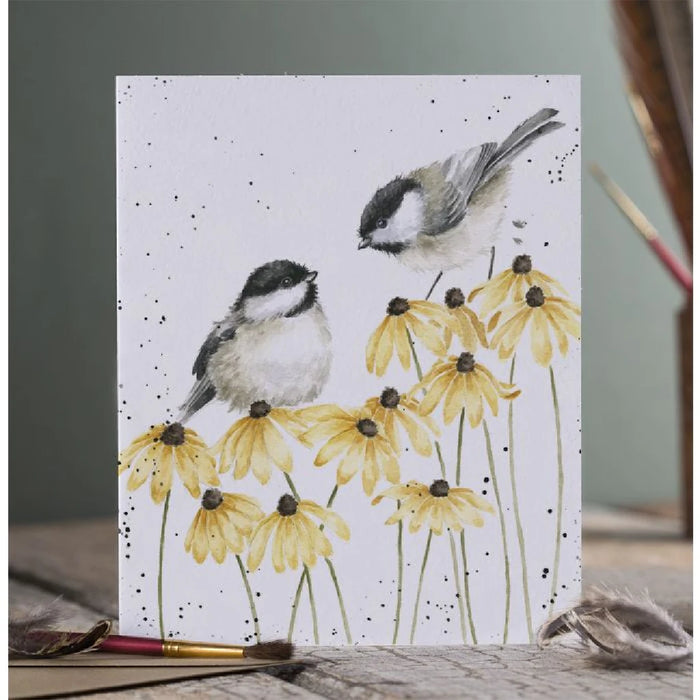 A decorative card showcasing two birds among cheerful yellow flowers, creating a lively scene.