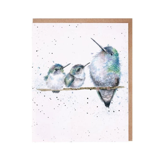 An illustration of three hummingbirds resting on a branch, depicted on a decorative card.
