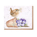 A card featuring a bird perched on a flower pot, surrounded by vibrant floral designs.