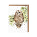 A card depicting an owl resting on a branch, surrounded by leaves and a serene backdrop.
