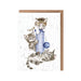  A card featuring two playful kittens chasing a colorful ball on a soft surface.