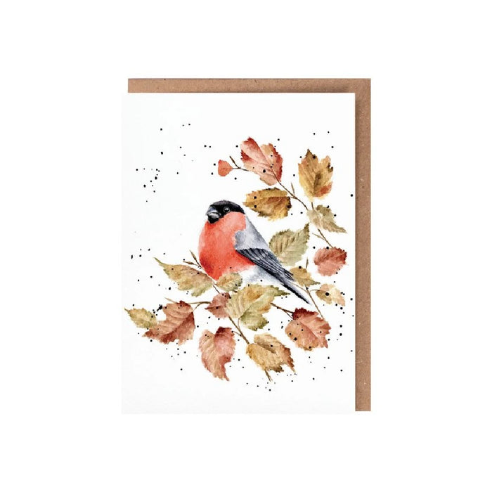 A greeting card featuring a red bird perched on a branch against a soft background.