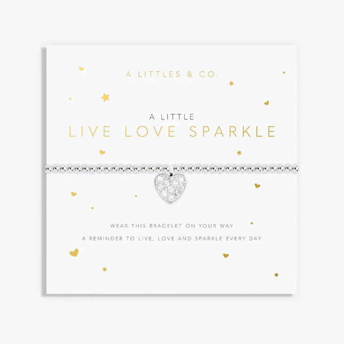 A close-up of a bracelet featuring the words "live," "love," and "sparkle" in a charming design.