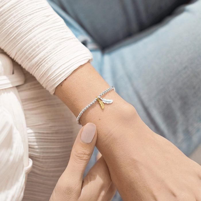 This A Littles & Co A Little 'Feathers' Bracelet offers a sweet way to remember someone special.