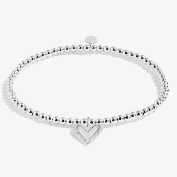 This A Littles & Co A Little 'Here's To Your Next Chapter' Bracelet celebrates exciting new beginnings. 