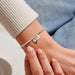 This A Littles & Co A Little Charmed Moments 'Friendship' Bracelet is a sweet way to celebrate a special bond. 