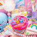 Colorful slime product with 'A'Lotl Slime Friends' branding, surrounded by stationery items on a colorful background.