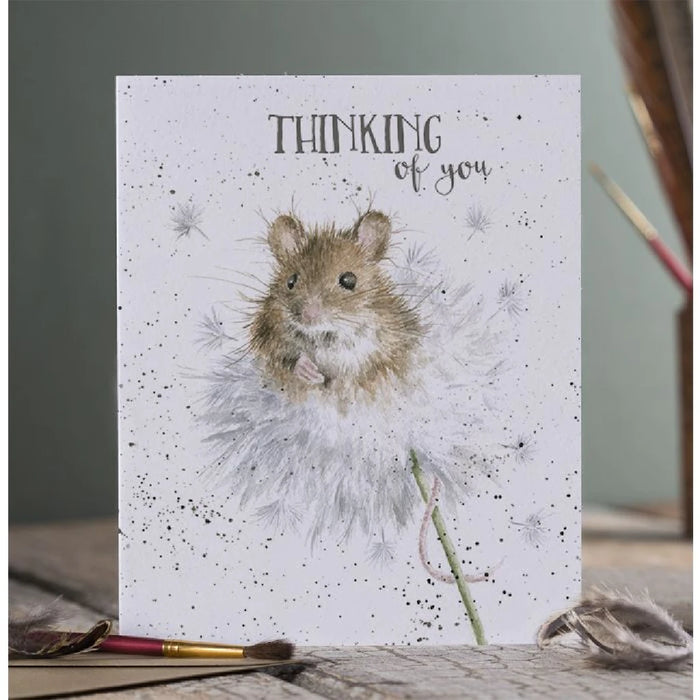 A whimsical card displaying a cheerful hamster alongside the phrase "Thinking of You" in vibrant typography.