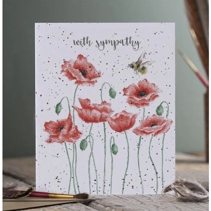 A beautifully designed sympathy card adorned with poppy illustrations, expressing heartfelt condolences.