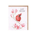A card featuring a red bird perched on a branch adorned with colorful flowers.