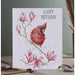 An illustration of a red bird on a branch surrounded by vibrant flowers on a card.