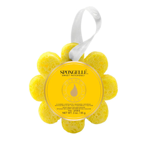 Yellow flower-shaped sponge with a label on a white background
