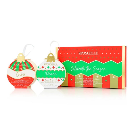 Spongellé Christmas-themed bath bomb packaging with 'Peace' and 'Cheer' designs on a white background.