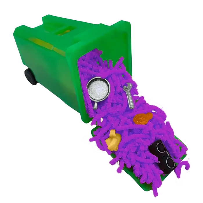Green toy box with a purple creature-like figure on top, featuring various small objects.