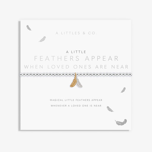 A Littles & Co. A Little Feathers bracelet on sentiment card featuring silver and gold feather charms