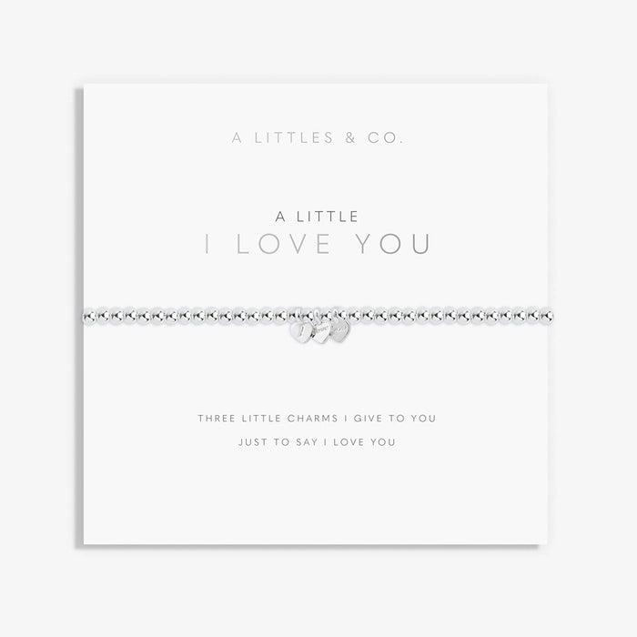 A Littles & Co. A Little I Love You bracelet with silver beaded stretch band and three heart charms on keepsake card