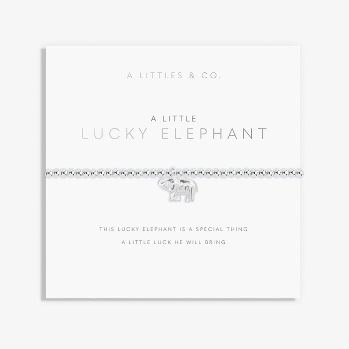 A Littles & Co. A Little Lucky Elephant bracelet with silver beaded stretch band and elephant charm displayed on keepsake card