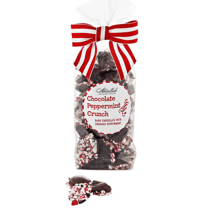 Bag of Abdallah Candies Dark Chocolate Peppermint Crunch with red-and-white bow and pieces of dark chocolate coated in crushed peppermint.