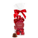 Bag of Abdallah Candies Holiday Caramel Bites wrapped in red foil with a red ribbon, featuring milk chocolate caramels and one unwrapped piece in front.