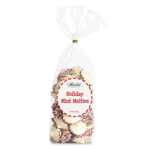 Bag of Abdallah Candies Holiday Mint Melties with white chocolate peppermint candies coated in red, green, and white sprinkles.