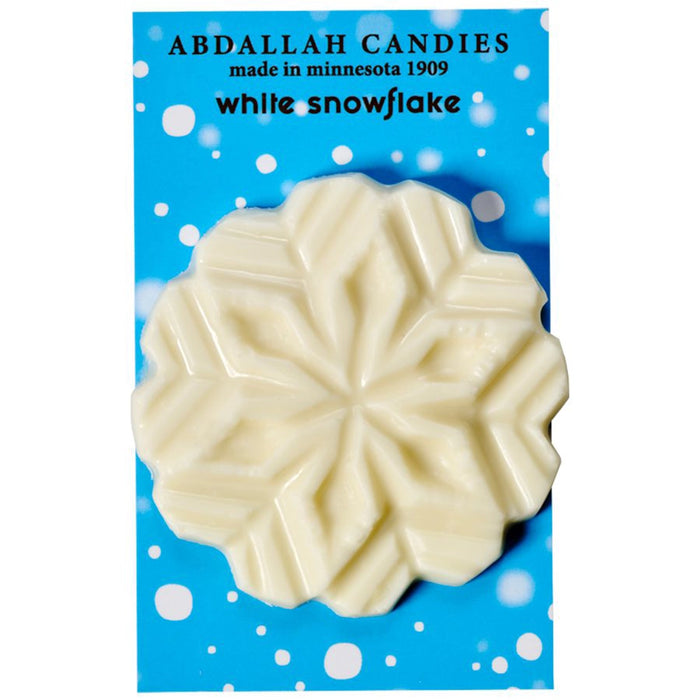 White chocolate snowflake by Abdallah Candies on winter-themed blue packaging with snowflake design.