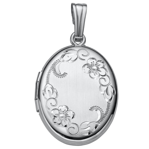 Silver locket with floral designs on a white background