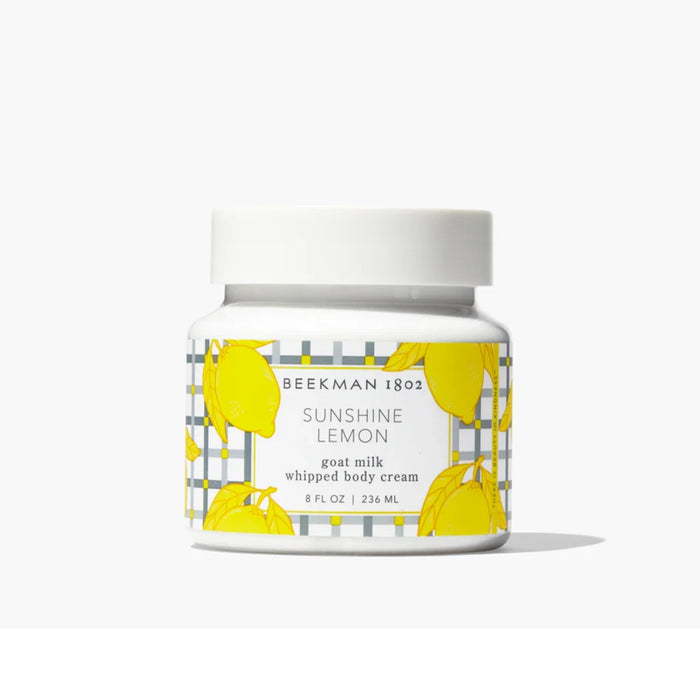 A jar of lemon and honey face cream, showcasing its creamy texture and natural ingredients for skincare.