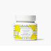 A jar of lemon and honey face cream, showcasing its creamy texture and natural ingredients for skincare.