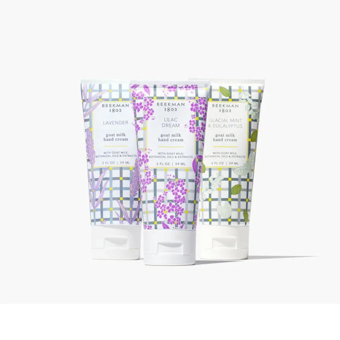 Three tubes of hand cream featuring colorful flower patterns, displayed side by side.