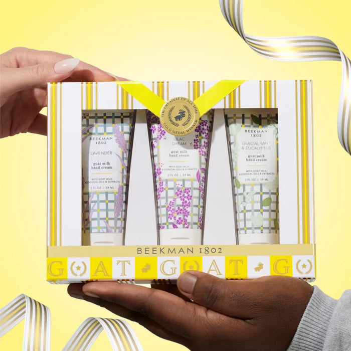 A trio of hand cream tubes, each decorated with unique floral illustrations.