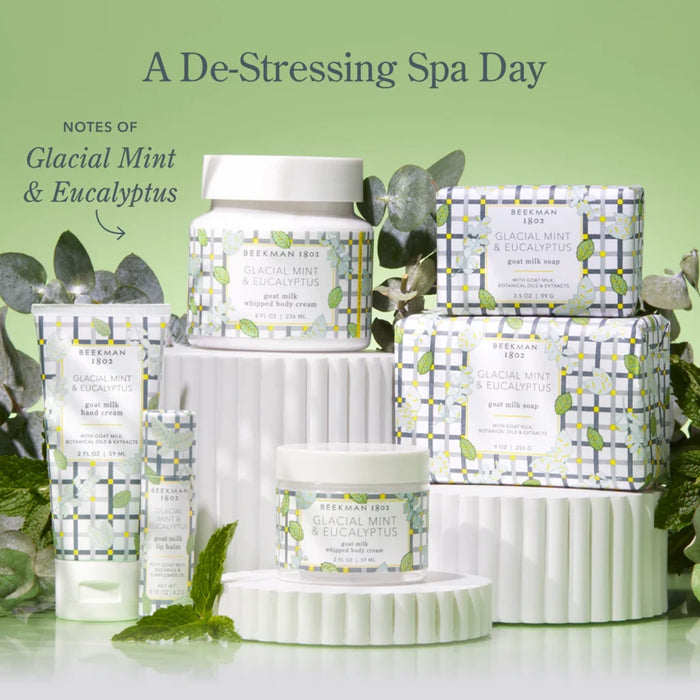 A serene spa setting featuring candles, essential oils, and a massage table, promoting relaxation and stress relief.