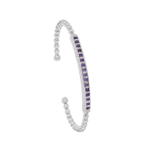 This rhodium-finished cuff features a striking pave bar detail that catches the light beautifully