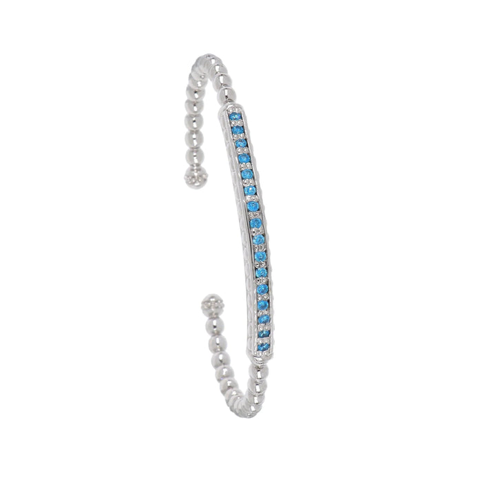 This rhodium-finished cuff features a striking pave bar detail that catches the light beautifully