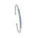 This rhodium-finished cuff features a striking pave bar detail that catches the light beautifully