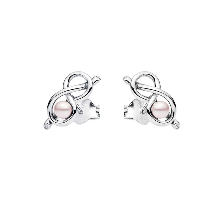 Silver earrings with pink gemstones on a white background