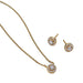 Gold necklace and earrings set on a white background