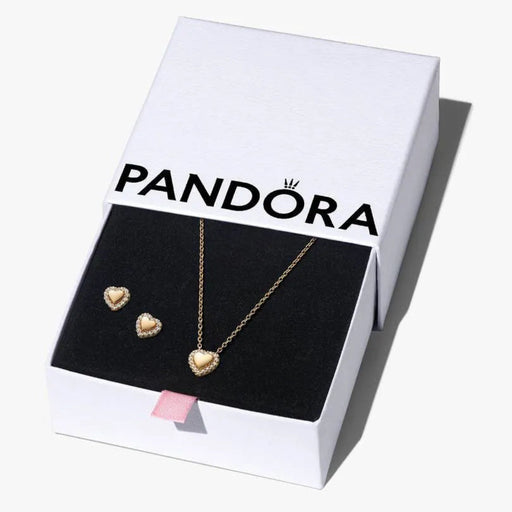 Pandora jewelry set with necklace and heart-shaped earrings on a branded box.
