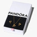 Pandora jewelry set with heart-shaped earrings and necklace on a branded box.