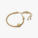 Gold bracelet on a white background