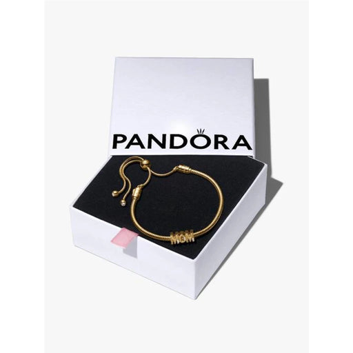 Pandora bracelet displayed in a box, featuring a gold clasp, elegantly arranged for presentation.