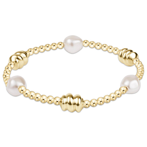 Admire Bracelet shown on a white background with gold beads and pearl detail