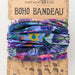 A colorful boho bandana made from a variety of vibrant fabrics, showcasing a mix of patterns and textures.